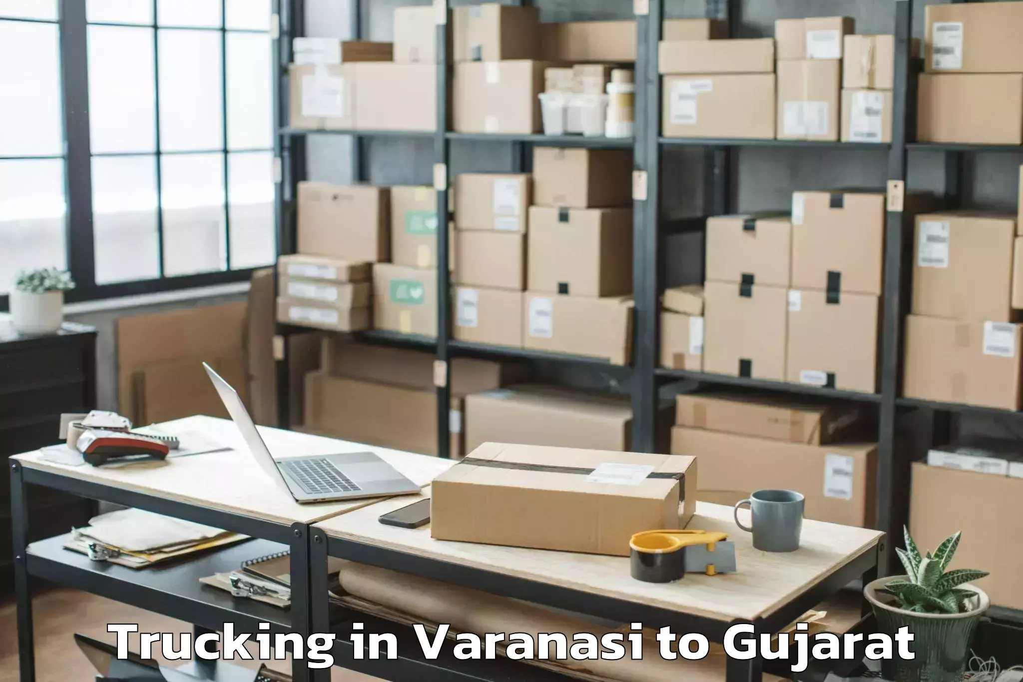 Varanasi to Junagadh Agricultural Universi Trucking Booking